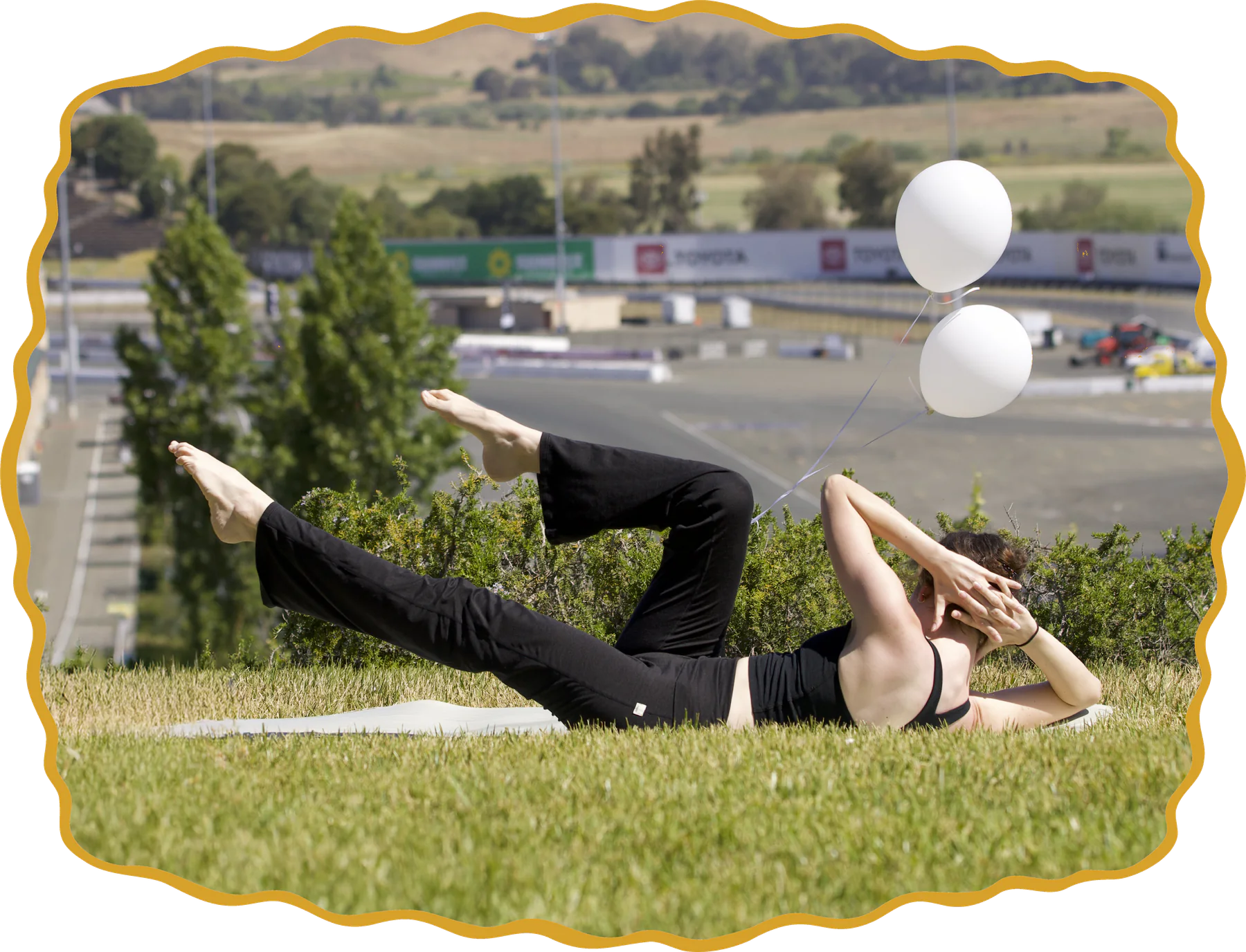 Pilates participants practicing on mats during an outdoor lawn class.
